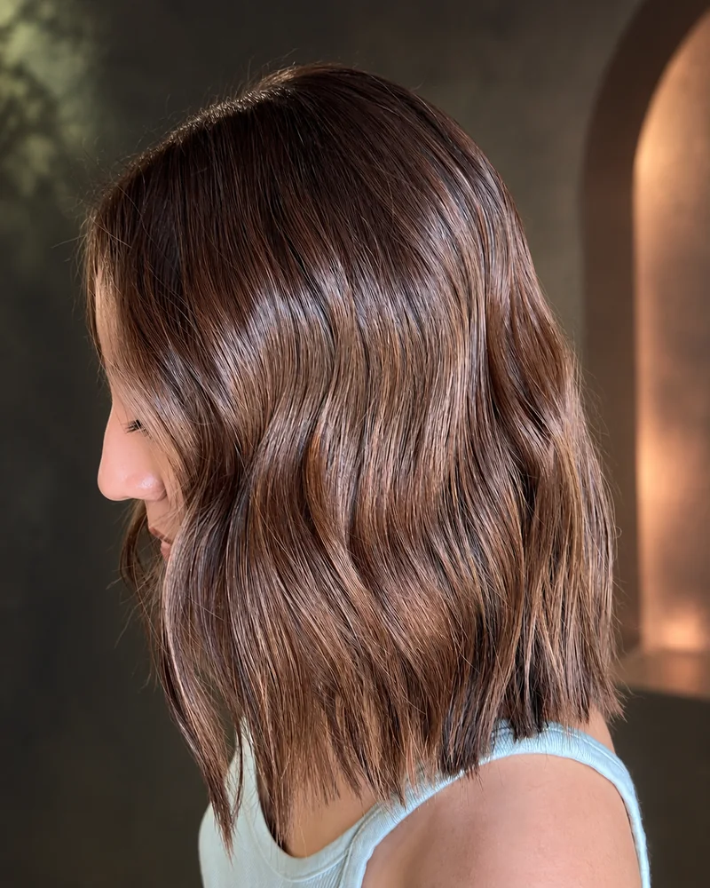 A short brunette bob with loose waves